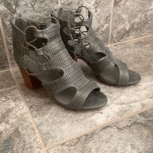 Gray high heels that zip up the back